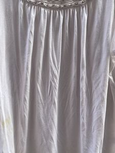 White Sleeveless Top with Embellished Neckline