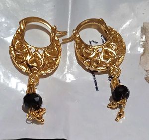Elegant Gold Jhumka Earrings with Black Stone