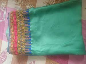 Title: Emerald Elegance: Lustrous Green Silk Saree