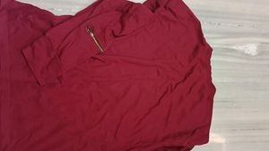 It's New Unused Maroon Coloured T Shirt.