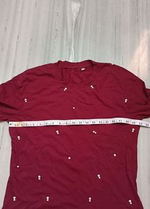 It's New Unused Maroon Coloured T Shirt.