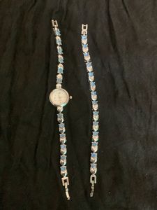 Elegant Silver Watch with Blue Stones