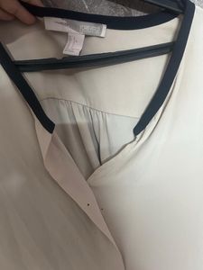 Elegant Cream Top with Black Trim
