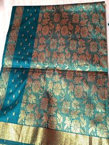 Elegant Teal Saree with Gold Paisley Border
