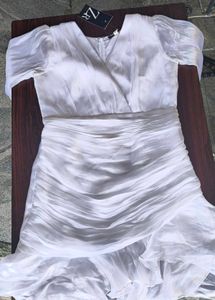 Elegant White Ruffled V-Neck Top