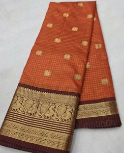 Elegant Orange Saree with Peacock Border
