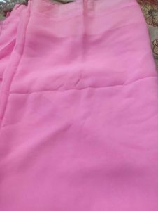 Embroidered silk blouse and plain pink saree
