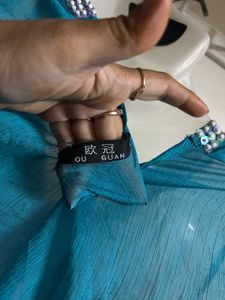 Stunning Teal Ruffled Top with Embellished Necklin