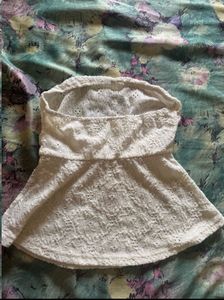 Two peplum  tops in black and white