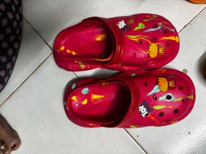 kids Orange Crocs with Green Splatter