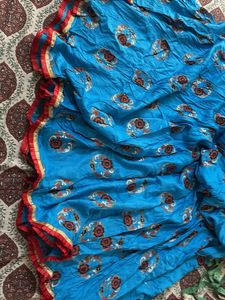 Vibrant Red Ethnic blouse and sky color chaniya