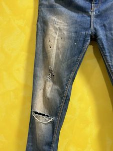 Distressed Blue Jeans with Paint Splatter