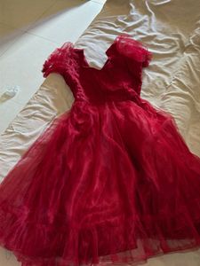 Stunning maroon mini frock with bow and clutches