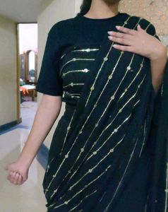 Elegant Black Saree with Golden Embellishments