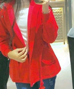 A Red Blazer With 3 Pockets &amp; belt On Waist