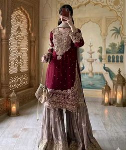 elegant red kurti set with black jhumka .