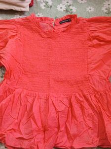Coral Smocked Peplum Top