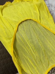 Yellow one-piece swimsuit with a deep scoop back