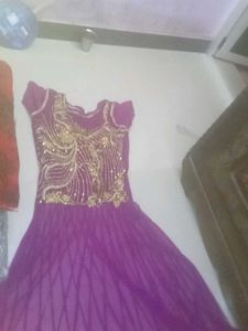 Elegant Purple Gown with Gold Embellishments