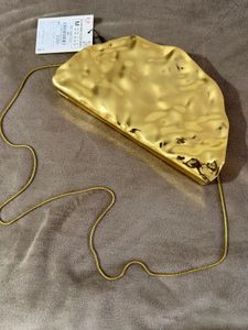 Golden Textured Clutch Bag.