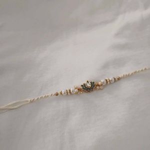 Elegant Pearl Rakhi with Lotus Pendant