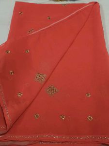 Elegant Orange Saree with Golden Embellishments