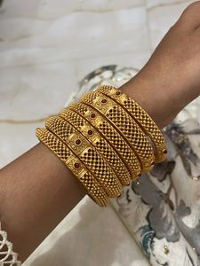 Set of 6 Gold Bangles with Red Stones
