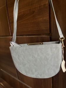 Grey half moon sling bag