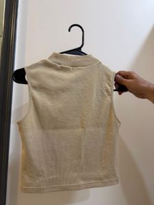 Sleeveless Mock Neck Top