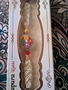 Beautiful Pearl Rakhi with Floral Pendant