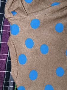 Tan color sweater top with blue dots