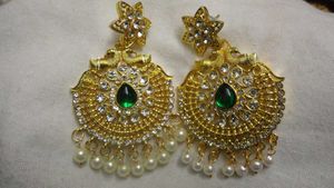 jhumkas and one peacock festive earring