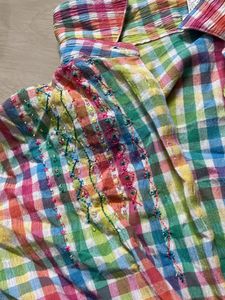 multicoloured shirt with a tie knot
