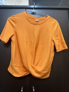 Trendy Orange Twisted Crop Top
