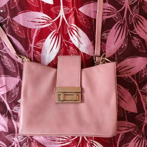 Chic Pink Handbag with Gold Clasp