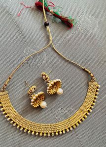 gold jewellery necklace with earrings
