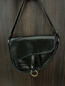 black textured shoulder bag