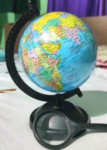 Globe With A Magnifying Glass