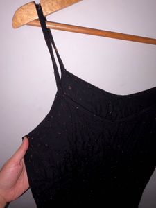 Black shiny polka dot dress