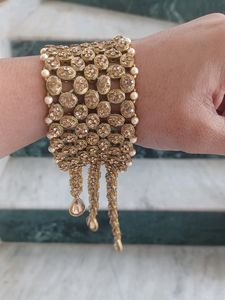 hand broad bracelet with kundan and Stine work. go