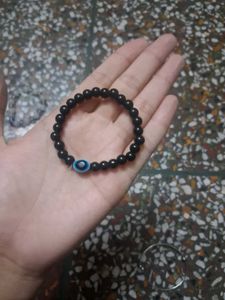 Beaded Bracelet with Blue Charm