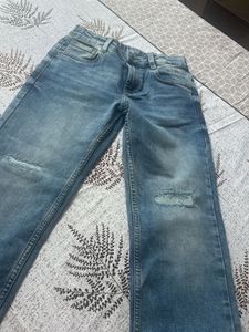 Distressed Blue Denim Jeans