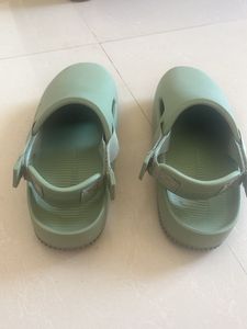 Mint Green Slides Nike brand.