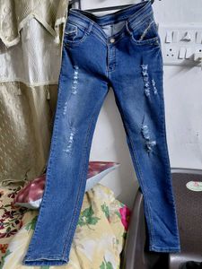 Distressed Blue Denim Jeans