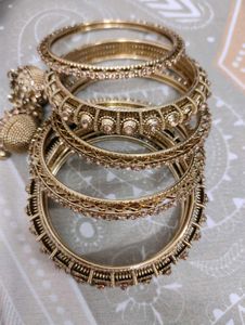 Set of Elegant Gold Bangles with Stones