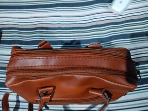 Stylish Brown Leather Handbag with Tassels