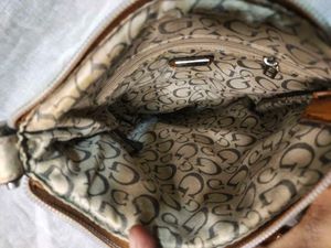 Authentic Guess snake patterned sling Bag