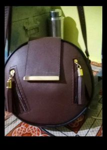 Stylish Round Maroon Handbag