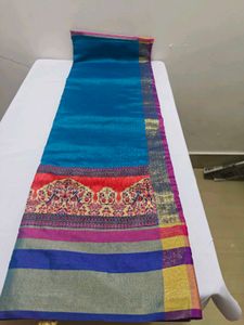 Vibrant Teal Saree with Colorful Border