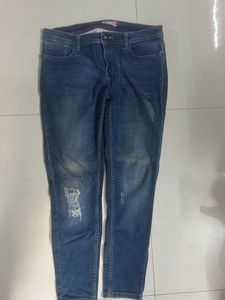 Distressed Blue Denim Jeans